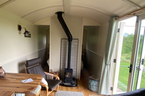 Interior of shepherd's with log burner